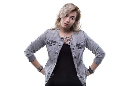 Unsatisfied young blond woman on white backgroundの写真素材