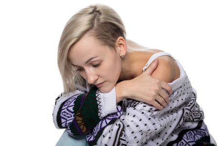 Gentle sad blond woman on white backgroundの写真素材