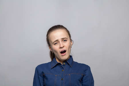 Portrait of yawning womanの写真素材