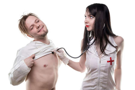 Nurse with stethoscope and sick patientの写真素材