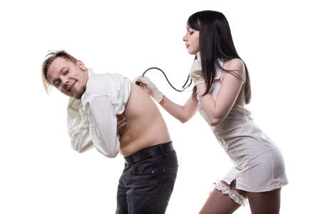 Sexy nurse with stethoscope and patientの写真素材