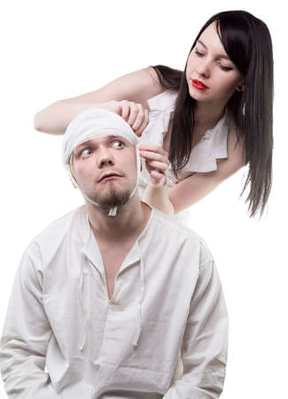 Sick patient bandaged by nurseの写真素材