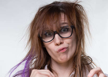 Grimacing scientist shaggy woman