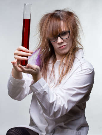 Scientist pride woman with red liquidの写真素材
