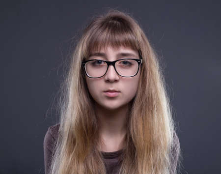 Portrait of teenage girl in glassesの写真素材