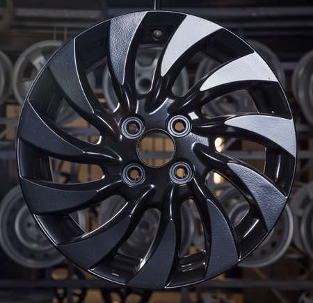 Drying of black disks after powder paintingの写真素材