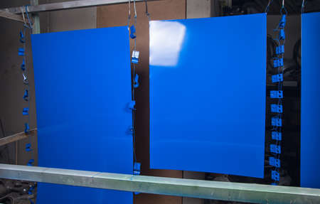 Powder coating and drying of blue detailsの写真素材