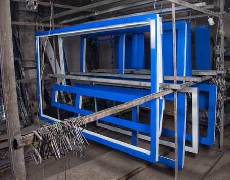 Powder painting and drying of metal blue doorsの写真素材