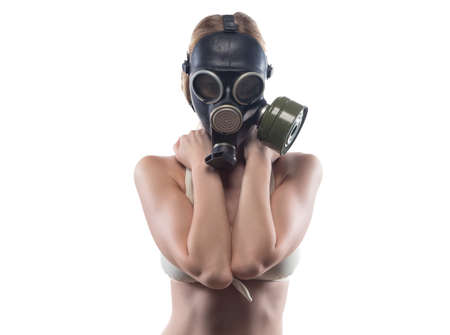 Young woman in gas mask covered breastの写真素材