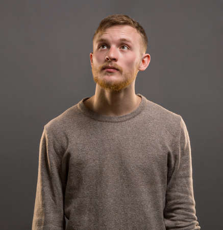 Portrait of young looking up man