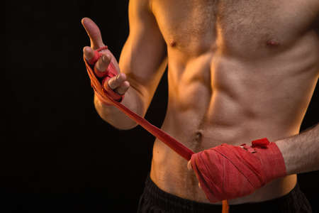 Man and red boxing bandagesの写真素材