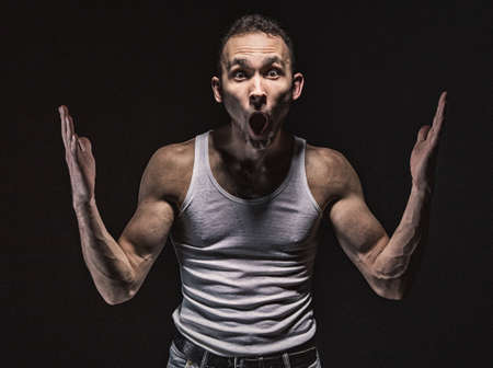 Portrait of surprised muscular manの写真素材