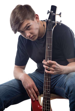 Teenage boy and bass guitar