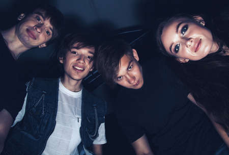 Photo of four friends from bottomの写真素材