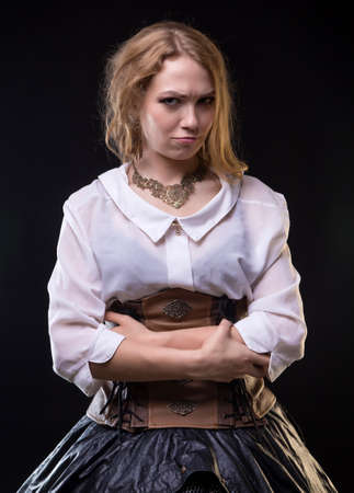 Blond grumpy woman in fantasy dressの写真素材