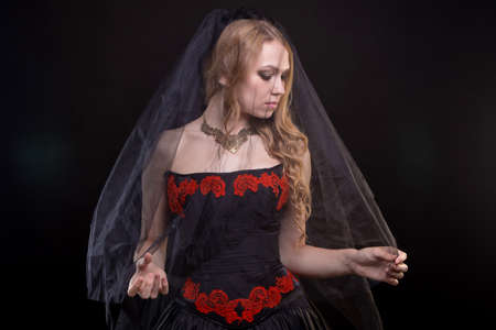 Blond girl with black veil