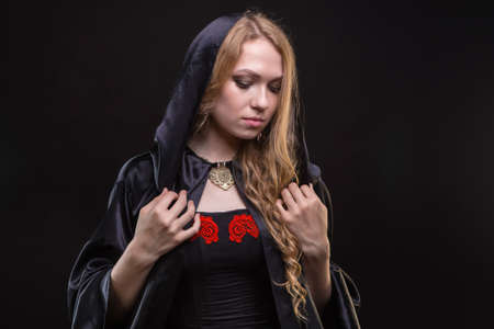 Blond woman in black hoodの写真素材