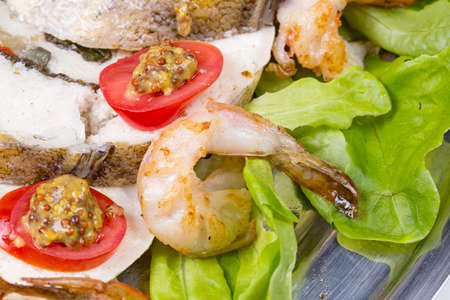 Stuffed seabass with shrimp and vegetablesの写真素材