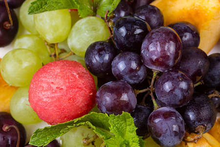 Fruits assorti - grapes and melonの写真素材
