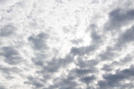 White cumulus cloudy sky with sunlight