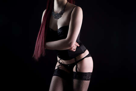 Woman in black sexual lingerie