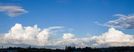 Photo of the sky with white clouds in the sunny day