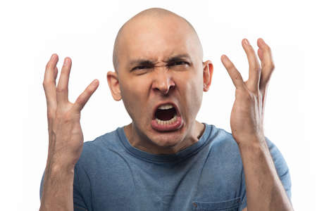Photo of the angry adult bald manの写真素材