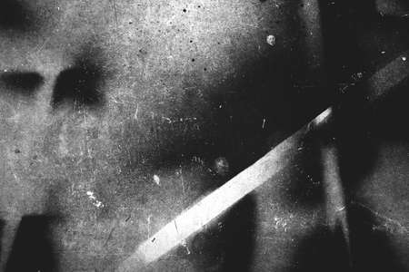 Old scratched surface texture in black and whiteの写真素材
