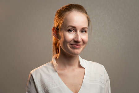 Photo of the young smiling ginger woman