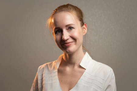 Photo of the young smiling cute ginger woman