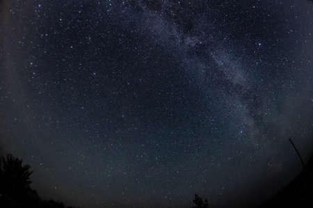 Photo of nightly blue sky with stars in the summer