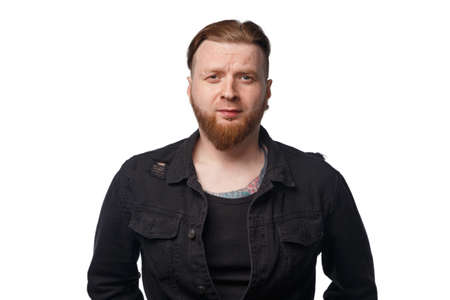 Photo of bearded man in black jeans jacket
