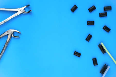 Photo of dental tools and black gum pads