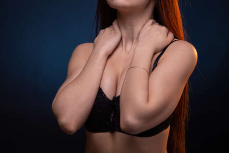 Image of young woman with hands on black braの写真素材