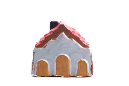 Shot of handmade painted house - souvenir on white backgroundの写真素材