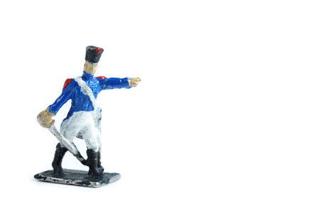 Photo of handmade metal soldiers figurine on the white background