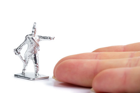Unpainted handmade metal soldier on white backgroundの写真素材