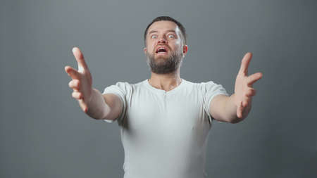 Photo of surprised young man with beard