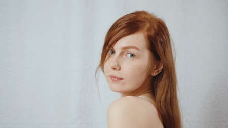 Portrait of redhead young girl in home interiorの写真素材