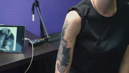 Photo of the woman before getting tattoo