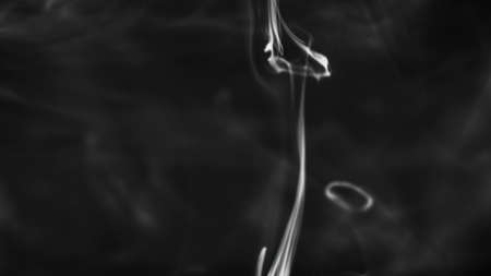 Shooting of white smoky drops flowing in liquidの写真素材