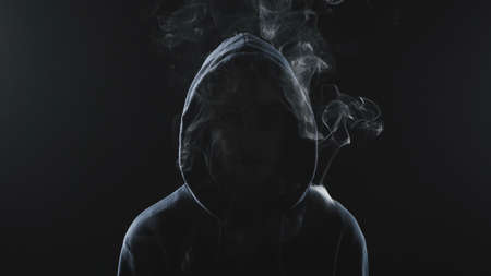Photo of smoker woman in the shadow