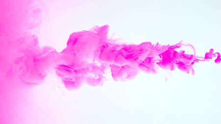 Image of pink paint flowing in waterの写真素材