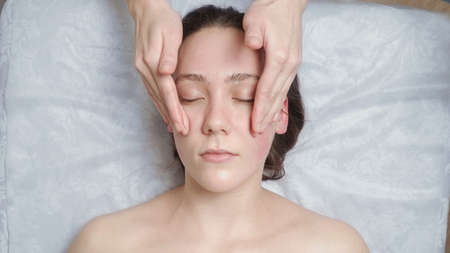 Shooting of woman gets a facial massageの写真素材