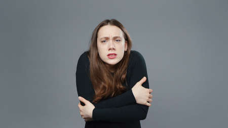 Photo of cold girl in black shirt