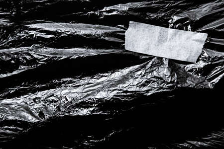 Photo of the polyethylene surface with white tape on black background