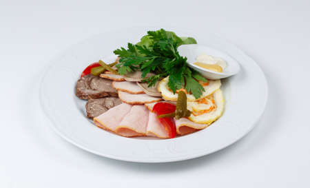 Photo of meat snacks on plate on white backgroundの写真素材