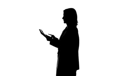Photo of womans silhouette with calc on isolated white backgroundの写真素材