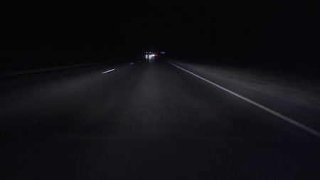 Moving car on the highway in the darkの写真素材