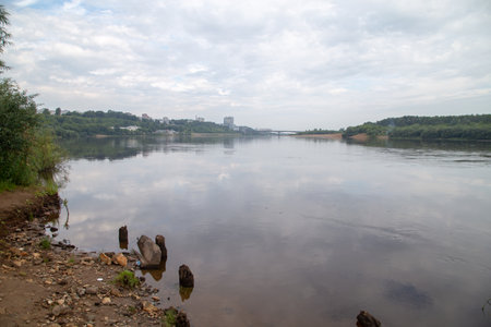 Image of the city on the river in cloudy dayの写真素材